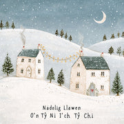 Nadolig Llawen o’n Tŷ Ni i’ch Tŷ Chi — Bythynnod yn yr eira / Welsh card featuring two snowy cottages beneath a crescent moon