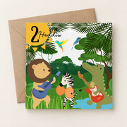 Cerdyn pen-blwydd 2 oed gyda band o anifeiliaid y jyngl, yn wastad gydag amlen frown / Welsh 2nd birthday card shown flat with a brown envelope.