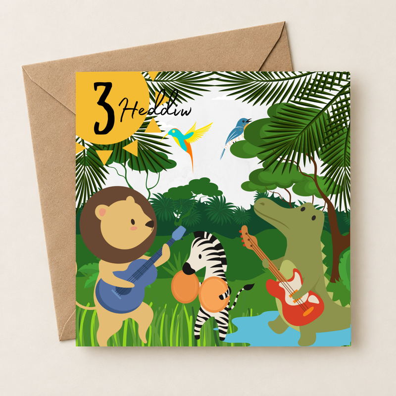 Cerdyn pen-blwydd 3 oed gyda band o anifeiliaid y jyngl, yn wastad gydag amlen frown / Welsh 3rd birthday card shown flat with a brown envelope.