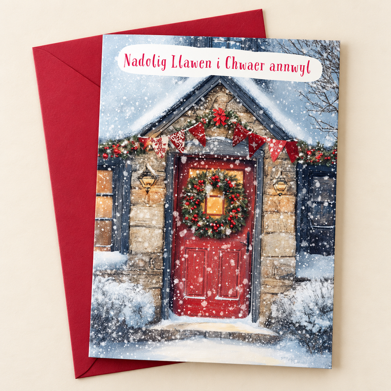 Cerdyn Nadolig Chwaer Annwyl – Drws Coch / Welsh Christmas card with a red door decorated for Christmas, lying flat beside a deep red envelope.