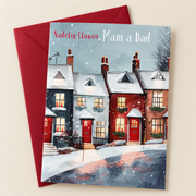 Cerdyn Nadolig Mam a Dad – Tai yn yr Eira / Welsh Christmas card with a row of houses in the snow, lying flat beside a deep red envelope.